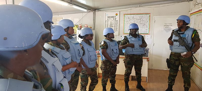 One of the key tasks of Ghanaian peacekeepers is to conduct day and night patrols. These female peacekeepers receive a briefing from their platoon commander before embarking on a patrol.