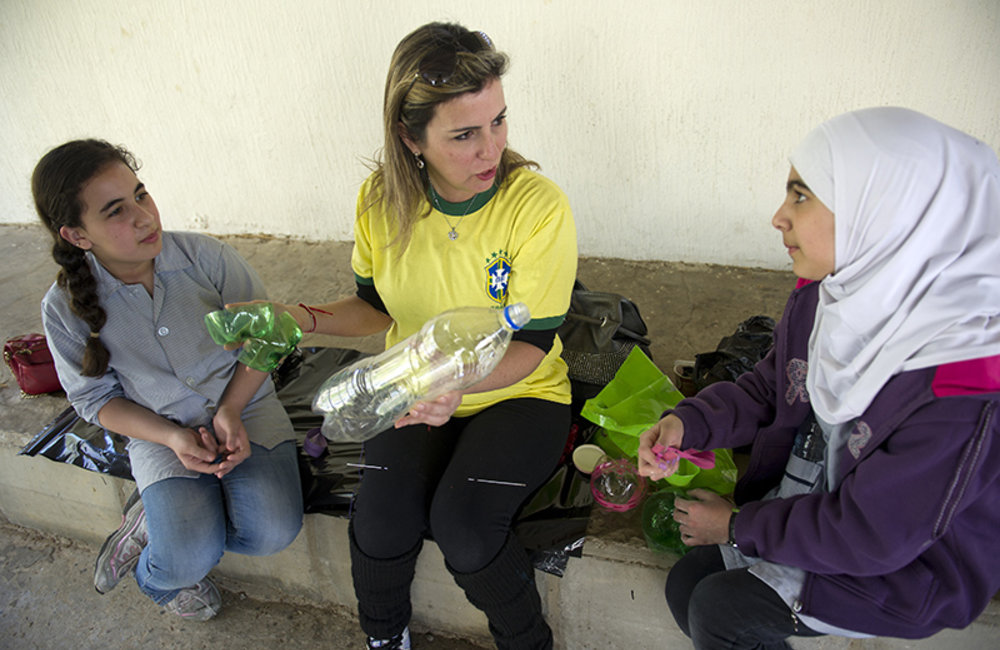 Trainer showing public school children how to recycle plastic trash during a workshop organized by UNIFIL Civil Affairs and in Tyre, South Lebanon.