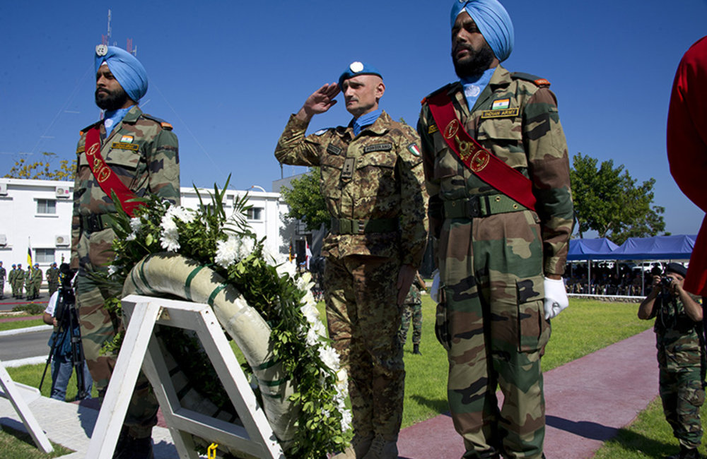 Head of Mission and Force Commander Major-General Portolano laying wreaths at the UNIFIL cenotaph in memory of fallen peacekeepers during UN Day.