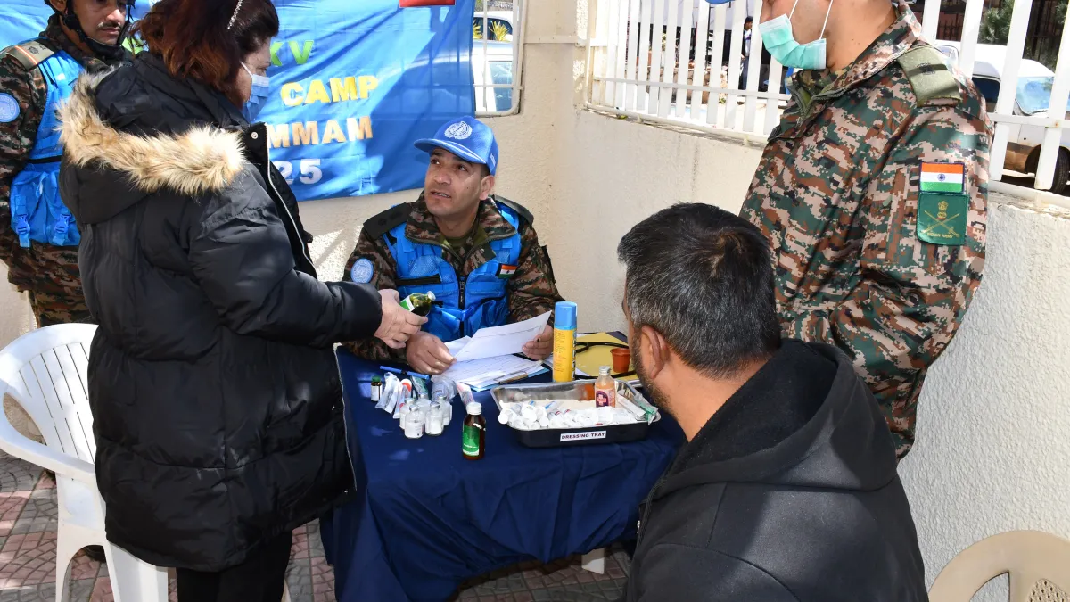 A medical peacekeeper talking with a patient