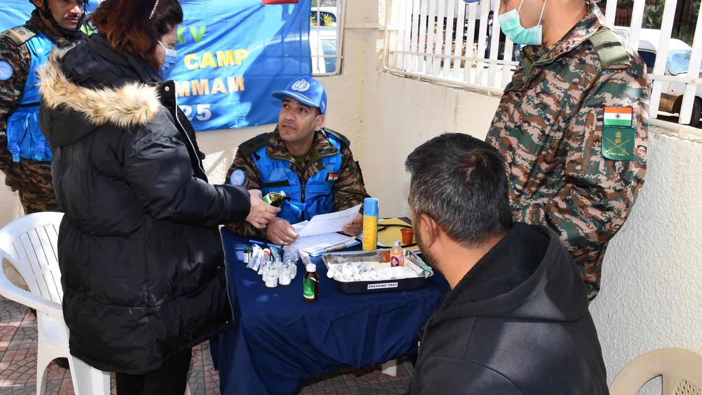 A medical peacekeeper talking with a patient