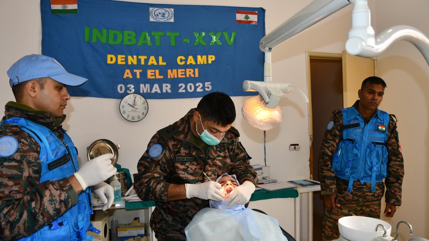 A medical peacekeeper conducting a check up of a dental patient