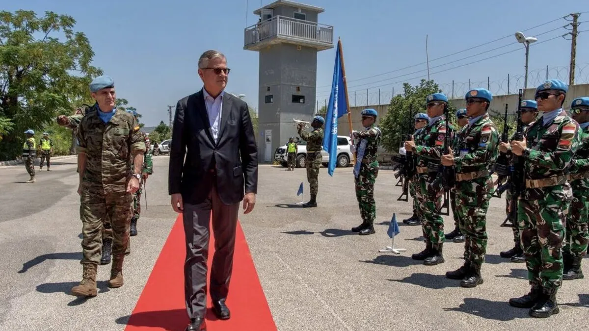 Jean-Pierre Lacroix walks alongside peacekeepers.