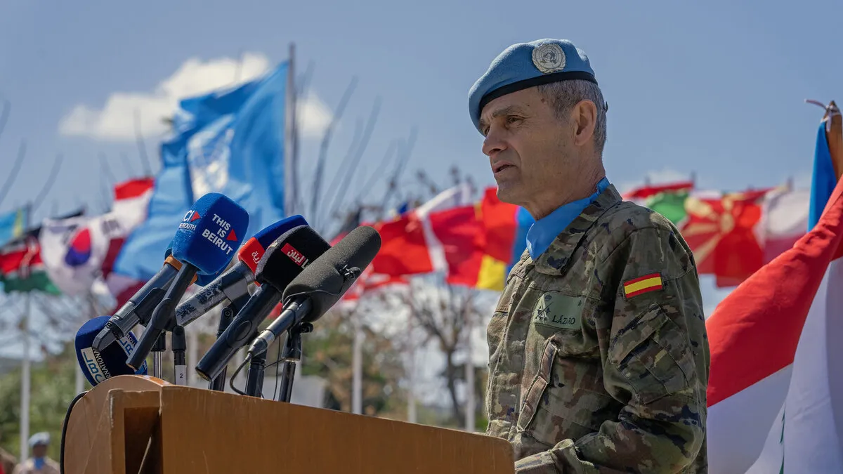 The Force Commander speaks at a podium.