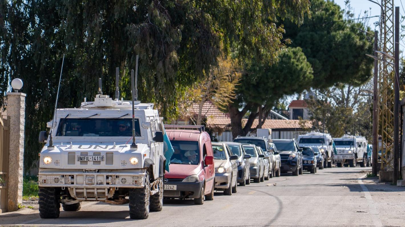 UNIFIL peacekeepers move with civilians on the way to safety
