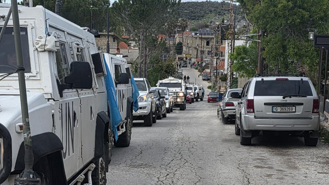 italian peacekeepers escort displaced persons from Debel 1