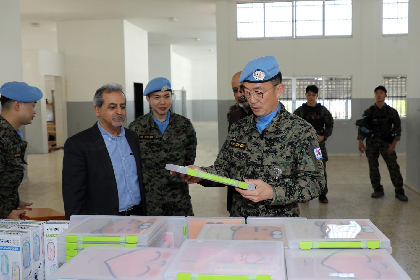 Peacekeepers standing in front of a table