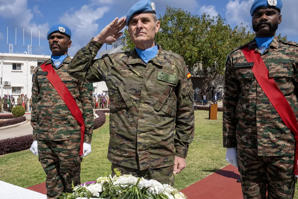 The Force Commander salutes.