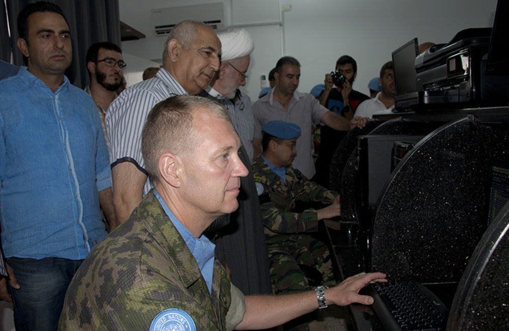 Col. Patrick Kajanmaa, Dr. Hassan Ezzeddine, Sheikh Hussein Darwish, and Lt.Col Zunaidi Hassan inspect the equipment donated by UNIFIL civil affairs to the public library of Barish.