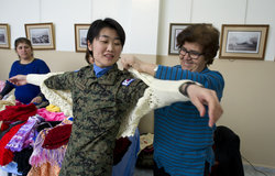 UNIFIL Korean peacekeeper buying handicrafts from the local Southern cooperatives at the International Women’s Day celebration held at Tyr’s Cultural centre