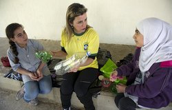 Trainer showing public school children how to recycle plastic trash during a workshop organized by UNIFIL Civil Affairs and in Tyre, South Lebanon.