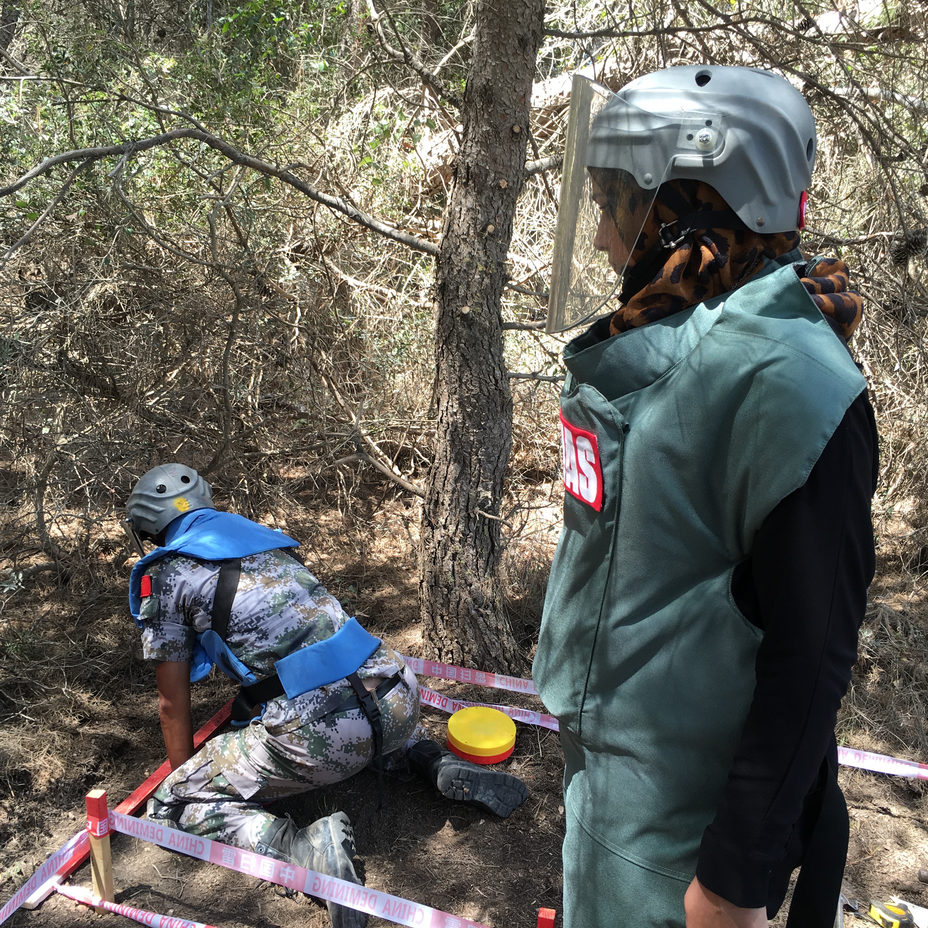 UNMAS Lebanon QA officer is conducting quality assurance on mine clearance procedures on Chinese deminer to make sure it is conducted in line with SOP